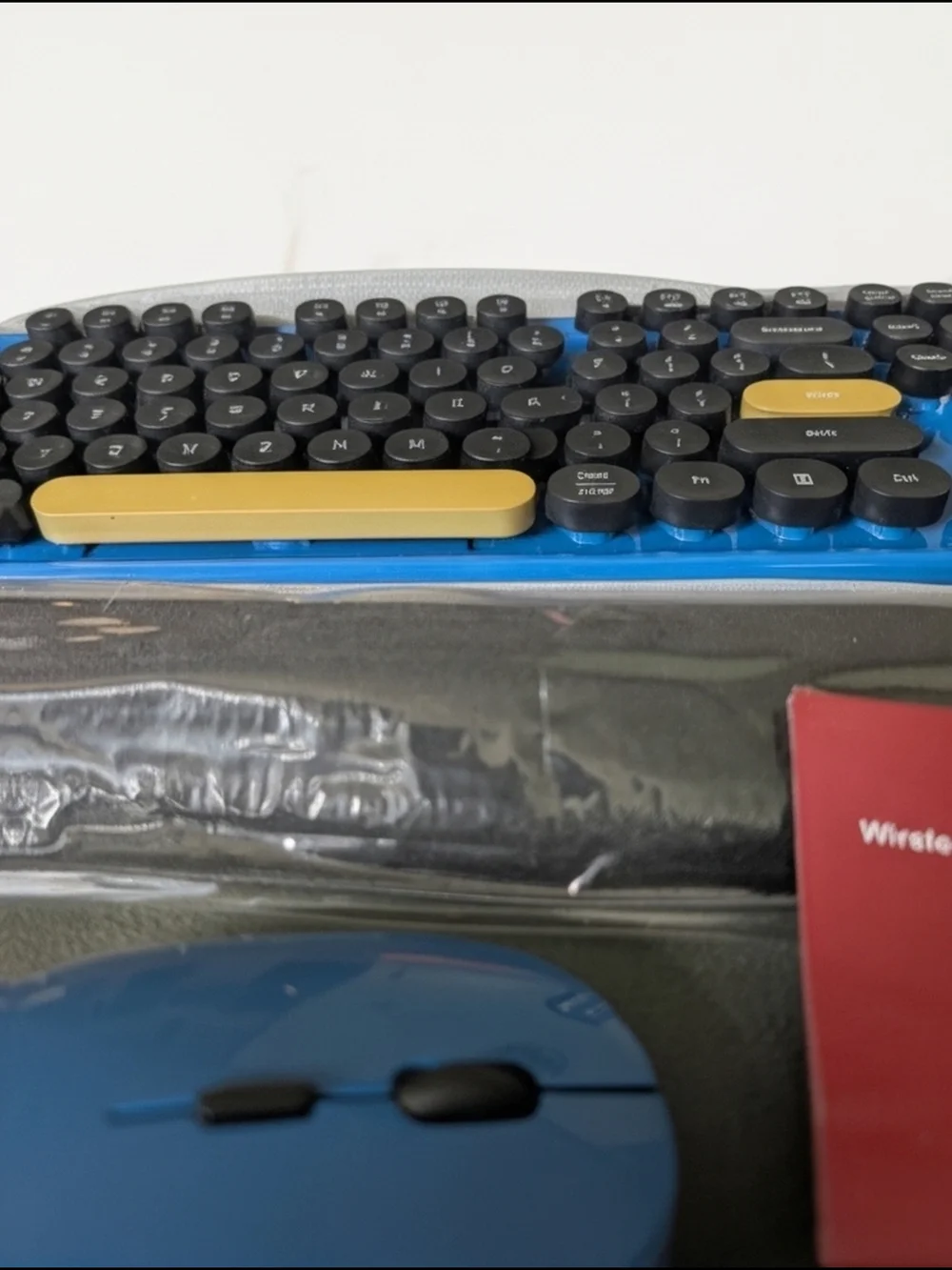 wireless keyboard and mouse combo featuring a blue and black retro typewriter.